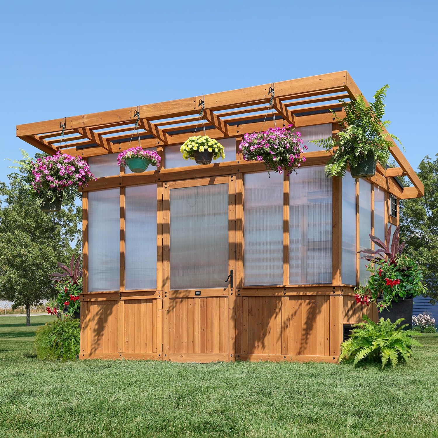 Backyard Discovery Poppy 11' x 7' Cedar Wood and Polycarbonate Walk-In Greenhouse Kit with Exhaust Fan, Windows, Hose Hook-Ups, PowerPort, Staging Shelves, Plant Hooks for Year-Round Outdoor Gardening